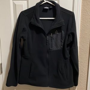 Woman’s Reebok black zip up jacket with side pockets. Size M